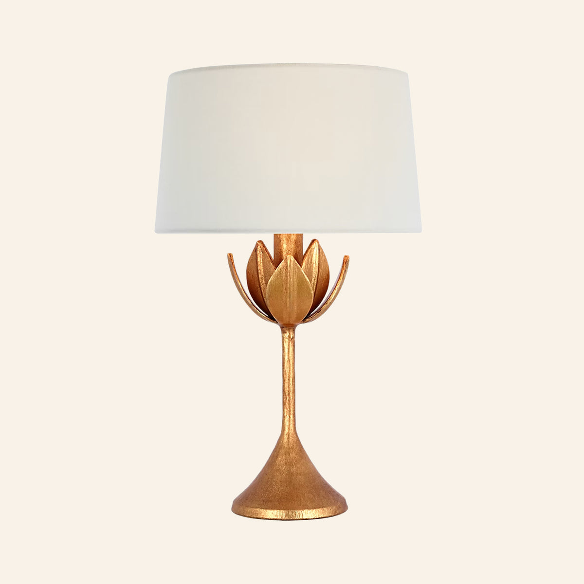 17-inch Julian cordless table lamp in antique gold leaf, a slender stem opening into a crown of leaves under a white linen shade, by Kevin Francis Design