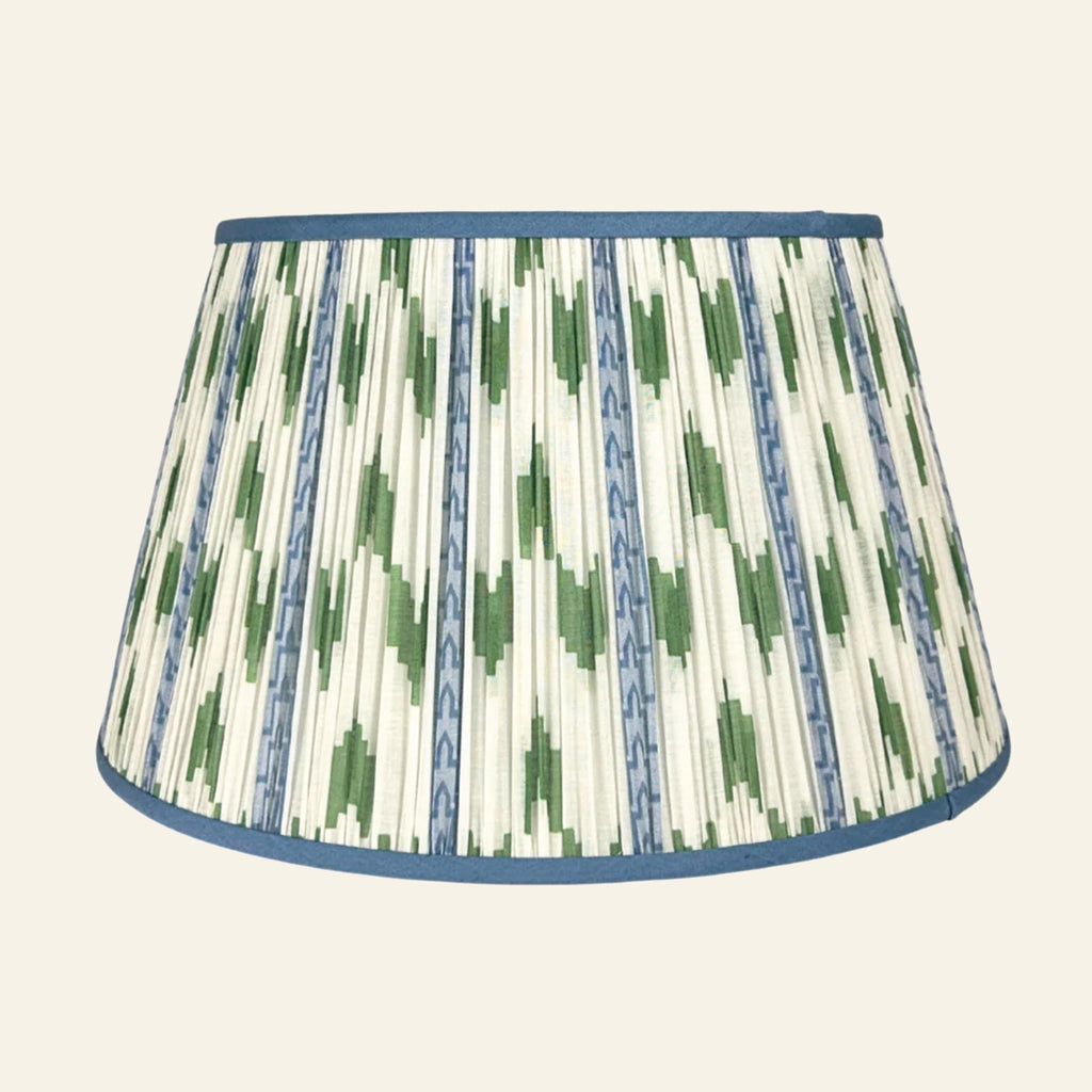 Blue and green ikat pleated lamp shade by Kevin Francis Design, featuring intricate patterns and elegant pleats.