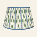 Blue and green ikat pleated lamp shade by Kevin Francis Design, featuring intricate patterns and elegant pleats.
