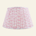 Rosewood pink printed pleated lamp shade by Kevin Francis Design, featuring elegant fabric with a pleated design for classic decor.