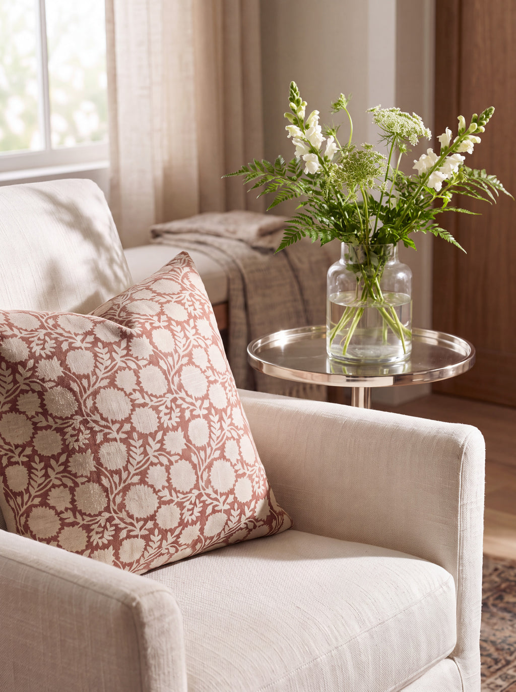 The Springlake block print pillow cover styled on a blush linen armchair