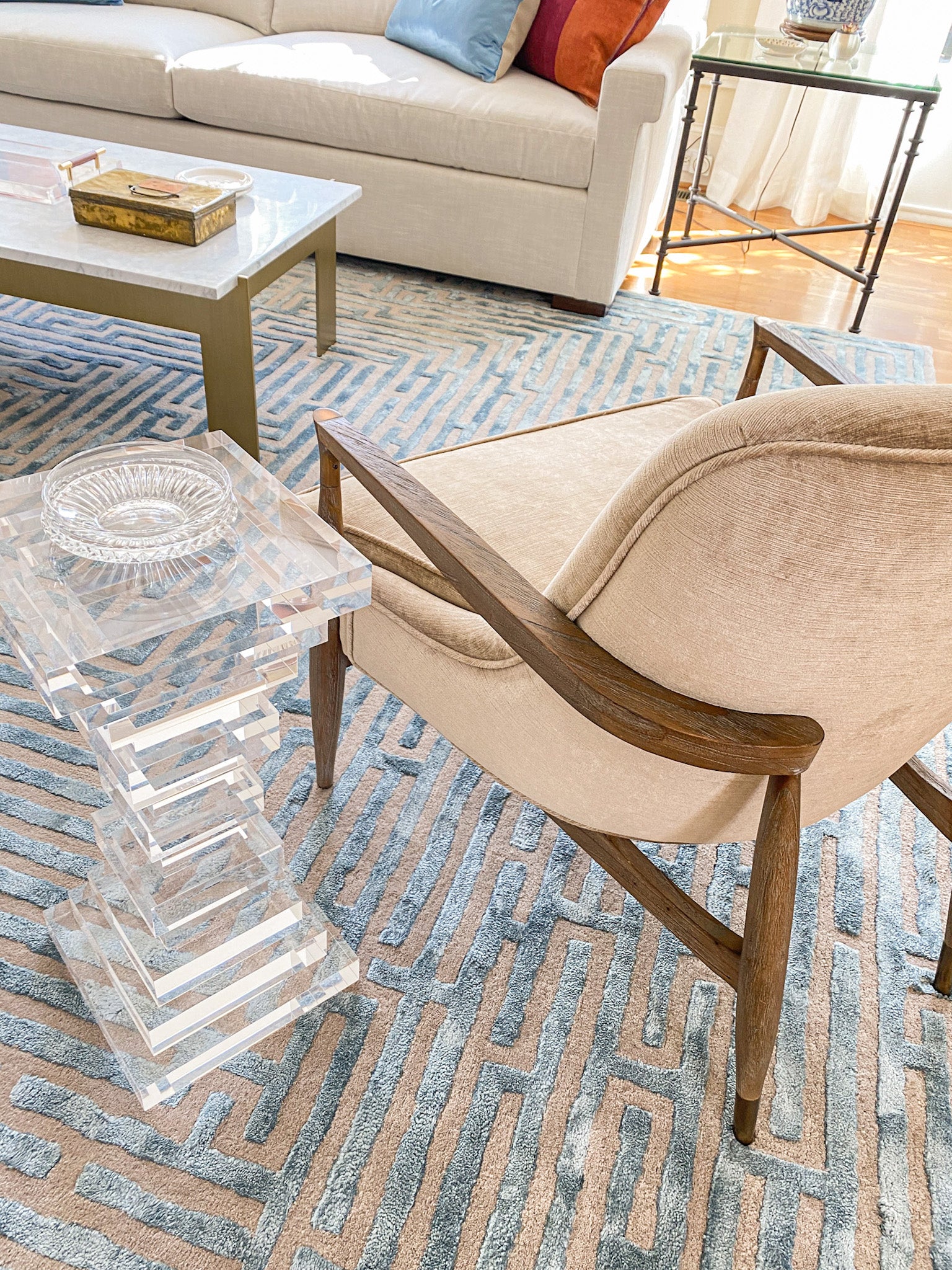 A living room with a Maze luxury floor rug in sky blue