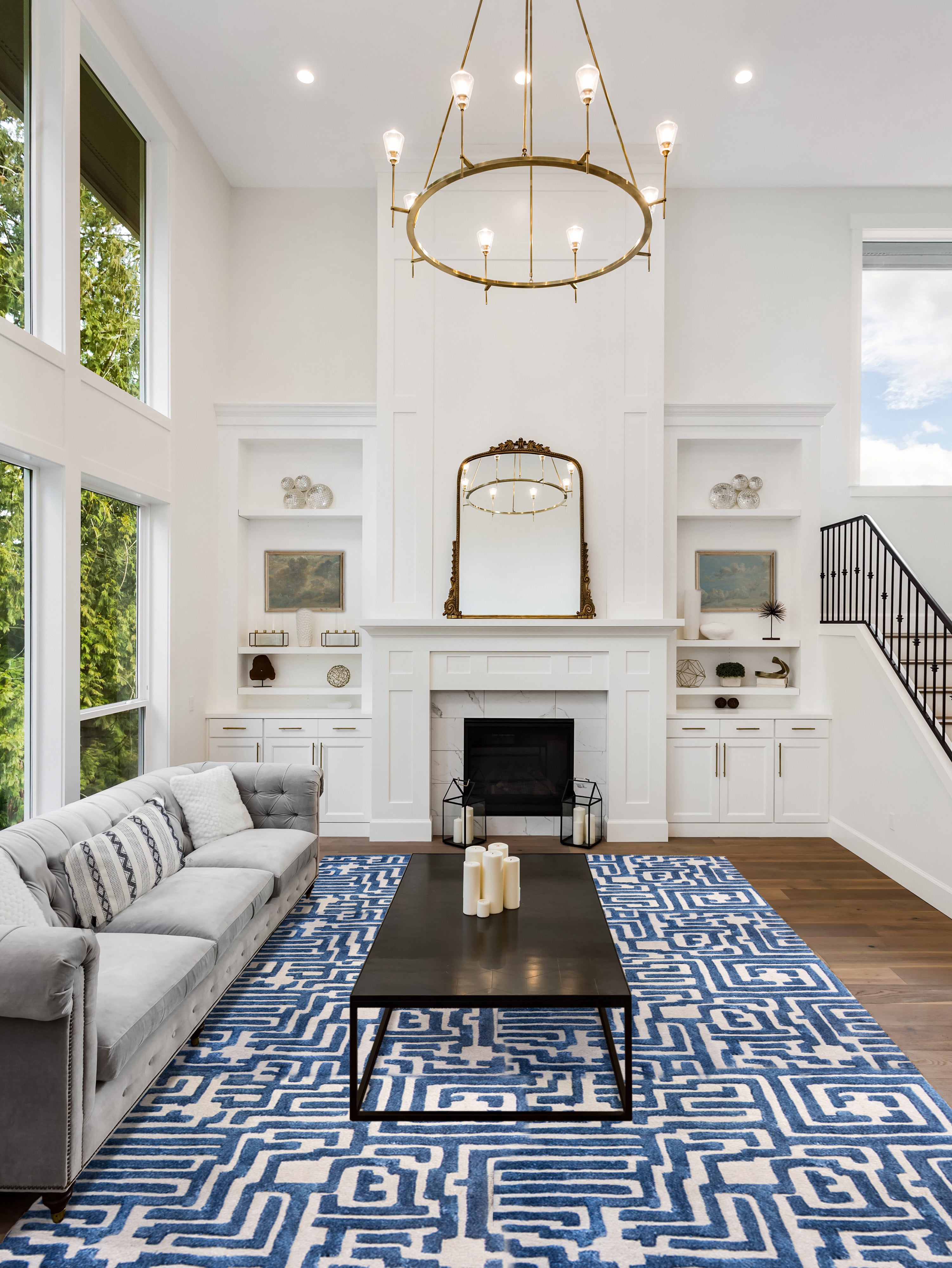 A living room with a large Maze luxury floor rug in blueberry blue