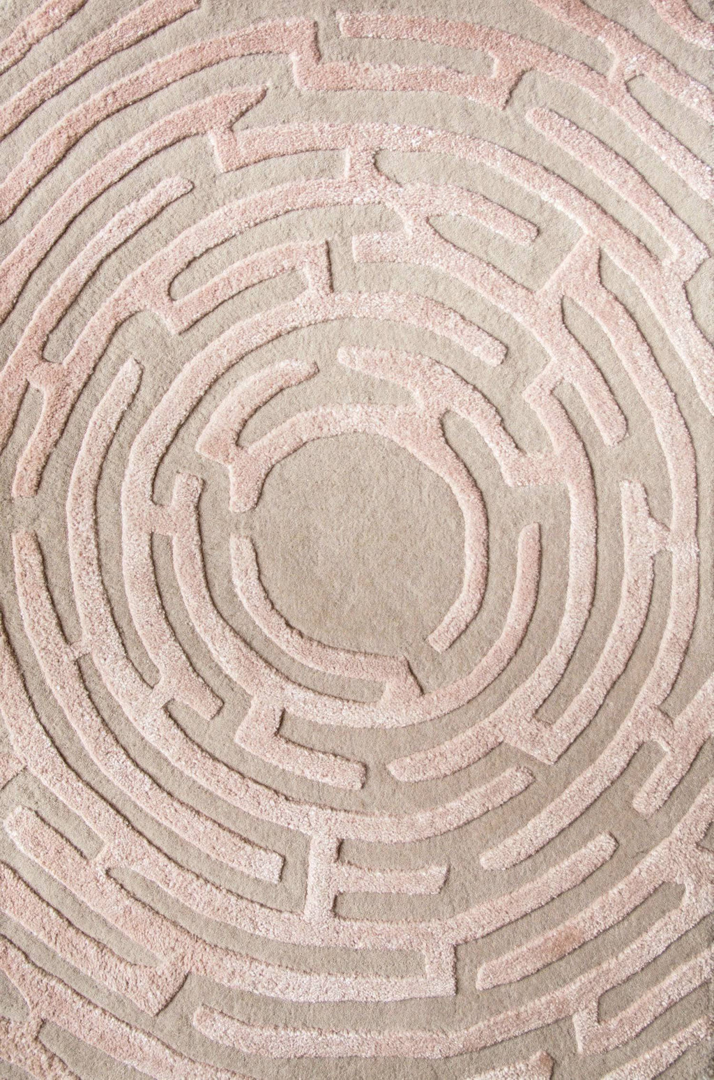 Maze luxury floor rug with a peony pink border outlining a beige maze