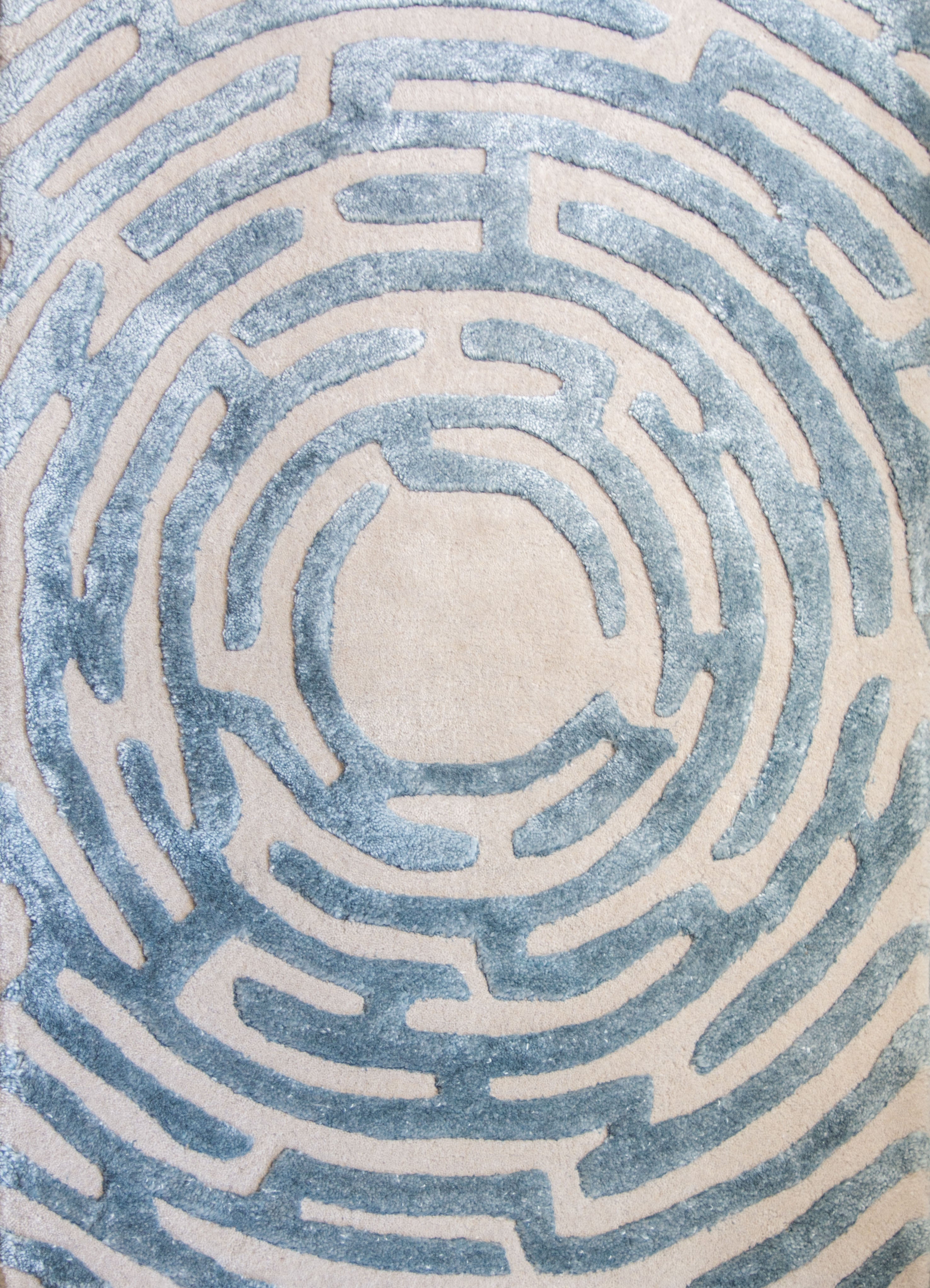 An up-close view of the center of a Maze luxury floor rug in sky blue