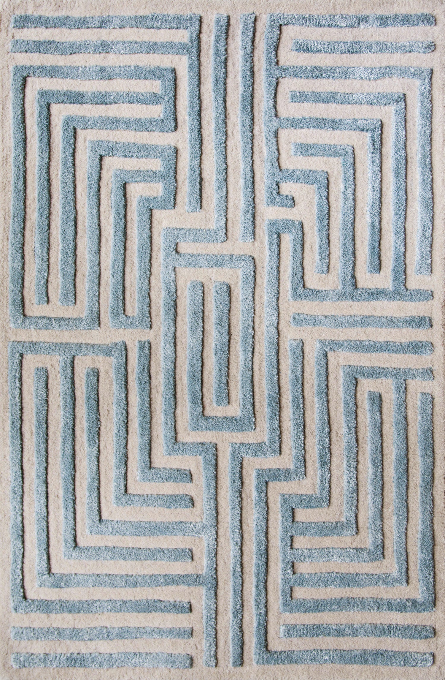 Maze luxury floor rug with a sky blue border outlining a beige maze